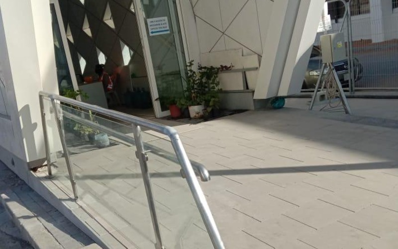 Stainless steel handrail with tempered glass infill installed at a Riyadh Metro station