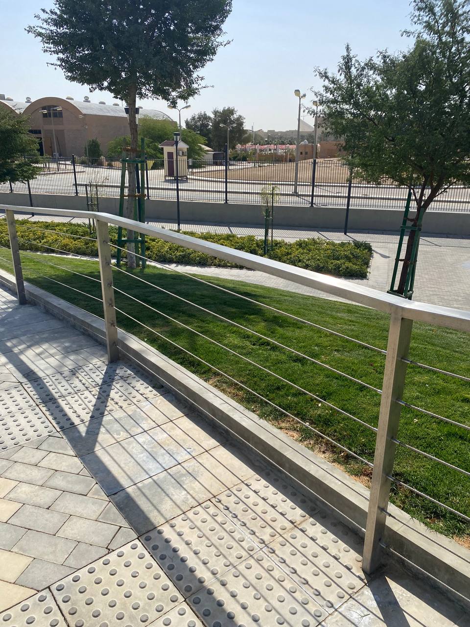 Stainless cable railing with tensioned horizontal runs along an accessible ramp in Riyadh