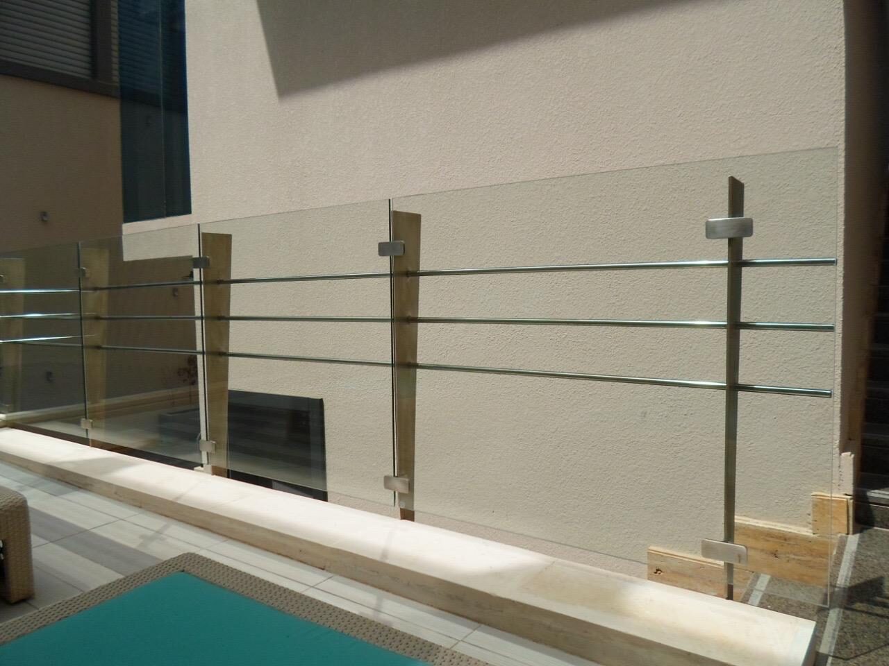 Stainless steel railing around a villa pool in Riyadh